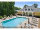 Sparkling pool area with ample seating for relaxing and soaking up the sun at 2565 Grapevine Cir # 103, Cumming, GA 30041