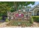 Stone community sign for The Orchards of Habersham Grove, surrounded by landscaping at 2565 Grapevine Cir # 103, Cumming, GA 30041