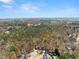 A picturesque aerial view showcases the property's lush surroundings, neighborhood, and community amenities at 400 Surveyors Pt, Suwanee, GA 30024