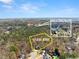 Aerial view of property with 2.05 acres that backs up to Sims Lake Park at 400 Surveyors Pt, Suwanee, GA 30024
