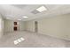 Spacious carpeted basement with a neutral color scheme and recessed lighting at 400 Surveyors Pt, Suwanee, GA 30024