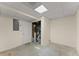 Clean, unfinished basement space with white walls and utility access behind an open partition at 400 Surveyors Pt, Suwanee, GA 30024