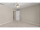 A lovely, naturally lit bedroom with neutral paint, a ceiling fan, and light carpeting at 400 Surveyors Pt, Suwanee, GA 30024
