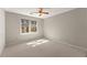 Cozy bedroom featuring neutral paint colors, plush carpeting, and a ceiling fan at 400 Surveyors Pt, Suwanee, GA 30024