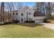 Charming two-story home with a well-maintained lawn and attached two car garage at 400 Surveyors Pt, Suwanee, GA 30024