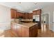 Beautiful kitchen with hardwood floors, a center island and stainless steel appliances at 400 Surveyors Pt, Suwanee, GA 30024