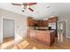 Open kitchen with hardwood floors, an island, and stainless steel appliances at 400 Surveyors Pt, Suwanee, GA 30024