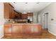 Spacious kitchen featuring hardwood floors, stainless steel appliances, and ample counter space at 400 Surveyors Pt, Suwanee, GA 30024
