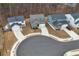 Aerial view of homes in a neighborhood featuring manicured front yards and paved driveways at 5 Dew Drop Pt, Dallas, GA 30157