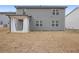Exterior of home with a covered patio and a spacious backyard at 5 Dew Drop Pt, Dallas, GA 30157