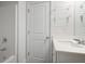 Bathroom with white vanity, sink, chrome fixtures, and a bathtub with shower at 5 Dew Drop Pt, Dallas, GA 30157