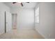 Bedroom with carpet, window and ceiling fan, and a doorway into another room at 5 Dew Drop Pt, Dallas, GA 30157