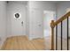 Inviting foyer with light wood flooring and a view of the staircase at 5 Dew Drop Pt, Dallas, GA 30157