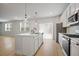 Bright, modern kitchen with white cabinets, stainless steel appliances, and a large island at 5 Dew Drop Pt, Dallas, GA 30157