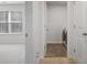 Laundry room next to bedroom with neutral walls and floors at 5 Dew Drop Pt, Dallas, GA 30157