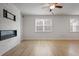 Spacious living room features hard wood floors, modern fireplace, and bright, natural light at 5 Dew Drop Pt, Dallas, GA 30157