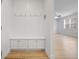 Mudroom with built-in bench and storage leading into open living space and nice floors at 5 Dew Drop Pt, Dallas, GA 30157