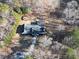 An aerial view of the home surrounded by mature trees and a long driveway at 511 Laird Rd, Hiram, GA 30141