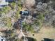 Aerial view of the home and lot with mature trees and long driveway at 511 Laird Rd, Hiram, GA 30141