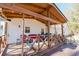 View of a covered back porch with string lights and outdoor seating at 511 Laird Rd, Hiram, GA 30141