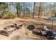 Outdoor seating area with firepit, seating, and outdoor dining set at 511 Laird Rd, Hiram, GA 30141
