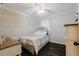 Cozy bedroom with white shiplap accent wall and dark hardwood floors at 511 Laird Rd, Hiram, GA 30141