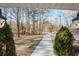 View of long concrete driveway leading to the property from the porch at 511 Laird Rd, Hiram, GA 30141