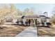 Quaint one-story home with charming shutters, decorative landscaping and well-manicured front yard creates an inviting appeal at 511 Laird Rd, Hiram, GA 30141
