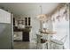 Cozy eat-in kitchen with granite countertops, stainless steel appliances, pendant lighting, and natural light from a window at 511 Laird Rd, Hiram, GA 30141