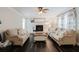 Spacious living room showcasing hardwood floors, neutral color scheme, and a fireplace, creating a relaxing atmosphere at 511 Laird Rd, Hiram, GA 30141