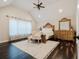 Vaulted ceiling primary bedroom with hardwood floors and ornate furniture at 511 Laird Rd, Hiram, GA 30141