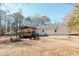 This home features a large yard and a covered deck, ideal for outdoor entertaining at 511 Laird Rd, Hiram, GA 30141