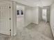 Finished basement area featuring neutral carpet, bright lighting, and access to other rooms at 2688 Kelly Cove Dr, Buford, GA 30519