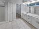 Bathroom featuring a shower, walk-in closet, double vanity, and tile flooring at 2688 Kelly Cove Dr, Buford, GA 30519