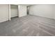 Finished basement bedroom area with neutral carpet, bright lighting, and walk-in closet at 2688 Kelly Cove Dr, Buford, GA 30519