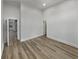 Spacious bedroom with hardwood flooring, light neutral walls and bright natural light at 2688 Kelly Cove Dr, Buford, GA 30519