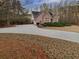 Lovely brick home featuring an attached garage and a spacious, paved driveway at 2688 Kelly Cove Dr, Buford, GA 30519
