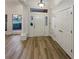 Elegant foyer with hardwood floors, a decorative front door, and white trim at 2688 Kelly Cove Dr, Buford, GA 30519