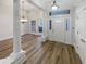 Inviting foyer with large decorative pillars, hardwood floors and natural light at 2688 Kelly Cove Dr, Buford, GA 30519