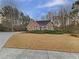 Inviting brick home with a well-maintained lawn and mature trees in a serene setting at 2688 Kelly Cove Dr, Buford, GA 30519