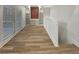 Hallway featuring hardwood floors, lots of natural light and custom built-ins at 2688 Kelly Cove Dr, Buford, GA 30519