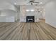 Spacious living room with hardwood floors and fireplace, perfect for entertaining at 2688 Kelly Cove Dr, Buford, GA 30519
