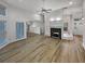 Open living space with lots of light, wood floors, and fireplace at 2688 Kelly Cove Dr, Buford, GA 30519