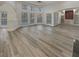 Bright, open living room featuring hardwood floors, a ceiling fan and arched entryway at 2688 Kelly Cove Dr, Buford, GA 30519