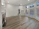 Bright living room featuring wood floors, fireplace, and lots of natural light at 2688 Kelly Cove Dr, Buford, GA 30519
