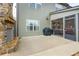 Back patio with gas grill, bench and fireplace; screened-in porch is nearby at 4030 Amberhill Cir, Cumming, GA 30040