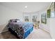 Cozy bedroom with bay windows offering natural light and an outside view at 4030 Amberhill Cir, Cumming, GA 30040