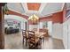 Elegant dining area with hardwood floors, decorative wainscoting, and a classic chandelier at 4030 Amberhill Cir, Cumming, GA 30040