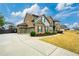 Beautiful home with a three car garage, long driveway and well maintained landscaping at 4030 Amberhill Cir, Cumming, GA 30040