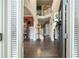 Elegant home foyer featuring hardwood floors, a soaring staircase, and neutral decor at 4030 Amberhill Cir, Cumming, GA 30040